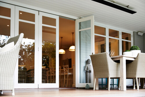 Exterior photography of the back porch of a suburban family home with coastal style architecture